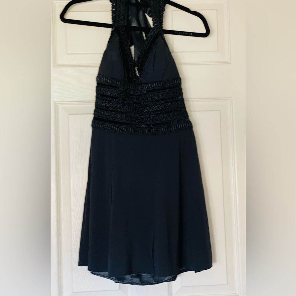 White House Black Market Black Cocktail dress. Size 4.